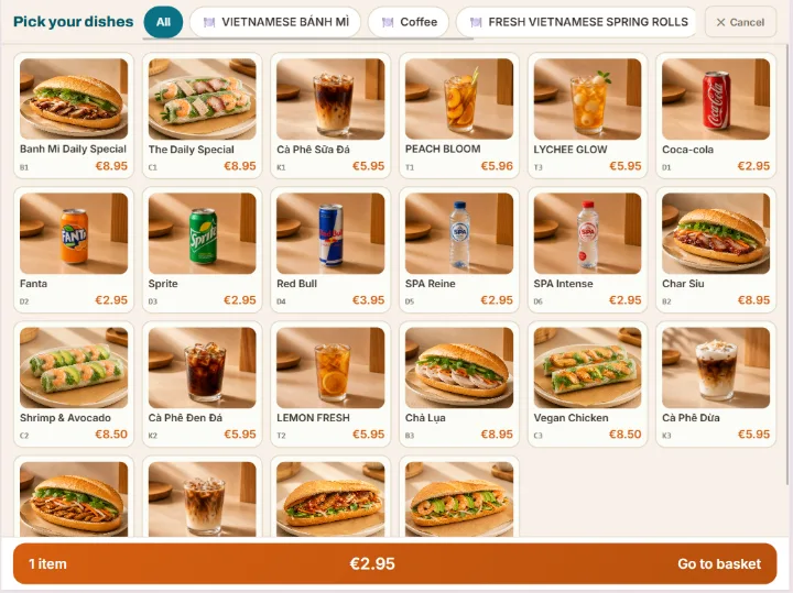 Kiosk screen titled Pick your dishes: a grid of dishes and drinks with prices, category tabs, and a Go to basket bar showing 1 item for €2.95.